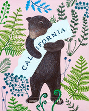 Load image into Gallery viewer, A serene-looking grizzly bear on its hind legs holds a white state of California in its front paws. The bear is surrounded by fern leaves of different varieties.
