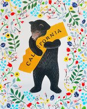 Load image into Gallery viewer, A serene-looking grizzly bear on its hind legs holds an orange state of California in its front paws. The grizzly is surrounded by a colorful floral pattern of all shapes and colors.
