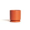 Load image into Gallery viewer, Rust: this cylindrical planter is a deep orange color.
