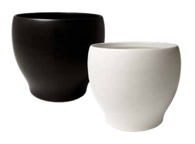 Paris Cache pots: two planters, one black and one white. The pots are wide on top and taper toward the bottom to give the planters a half-hourglass shape.