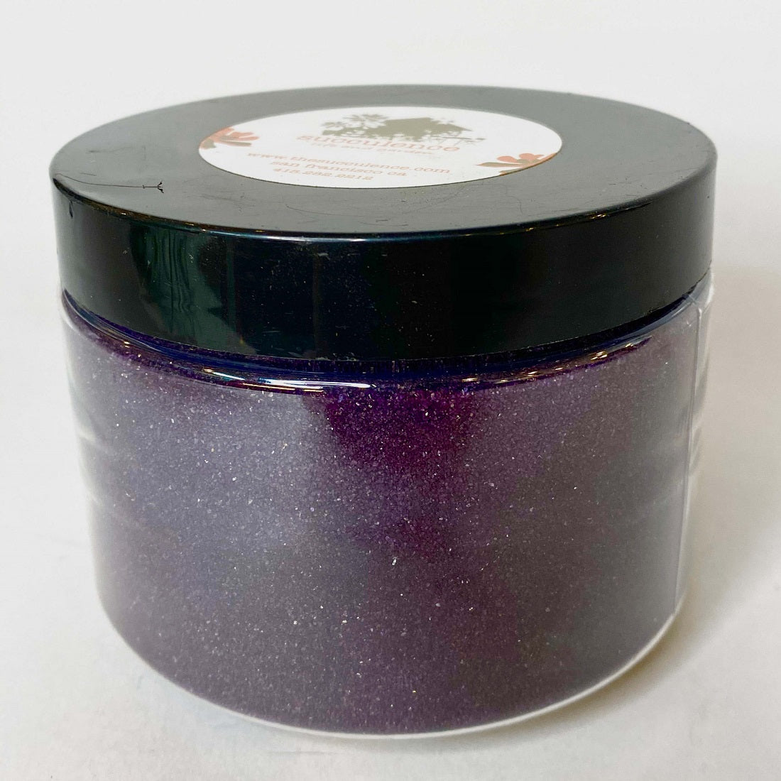 Eggplant Sand: a full, lidded jar holds a deep purple sand, which appears to be sparkling.