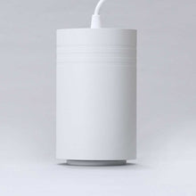 Load image into Gallery viewer, A white, cylindrical pendant light on a white background.
